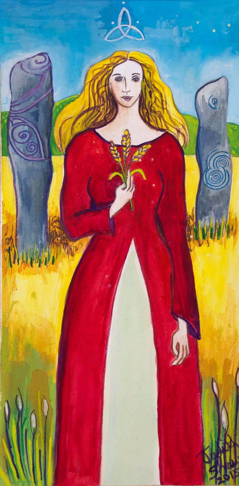 Aine is wearing a red dress standing in front of a golden grain fields. She is holding three strand of grain in her hand. Behind her, there are ancient Celtic rocks with ruins on them.
