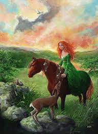 Aine is riding a horse while wearing a green dress and her red hair is loose. She is reaching over to touch a deer in front of her. They are in a countryside during a colorful sunset. 