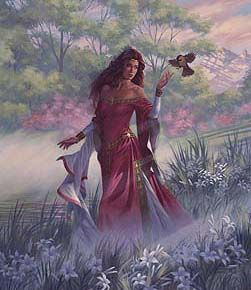 Goddess Cliodhna is wearing a ancient Celtic dress in pink while she walks through a flower field. She holds her hand up to touch a bird that is flying by.